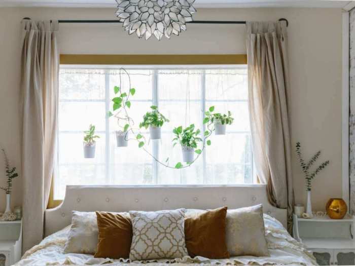 How to decorate bedroom with window behind bed